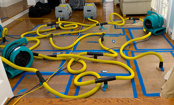 Professional Flood Damage Restoration technician working in Corning, NY